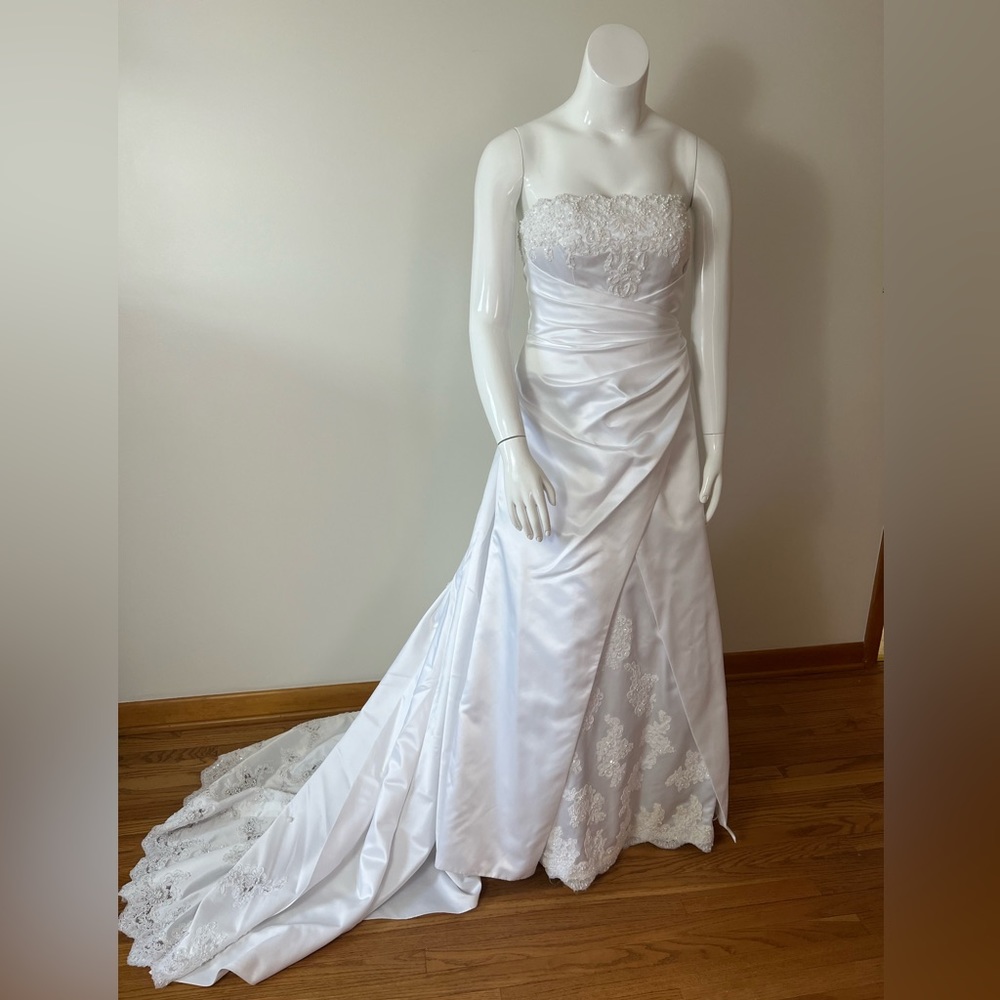 David’s Bridal style E8396 corset back A-line with beautiful train.